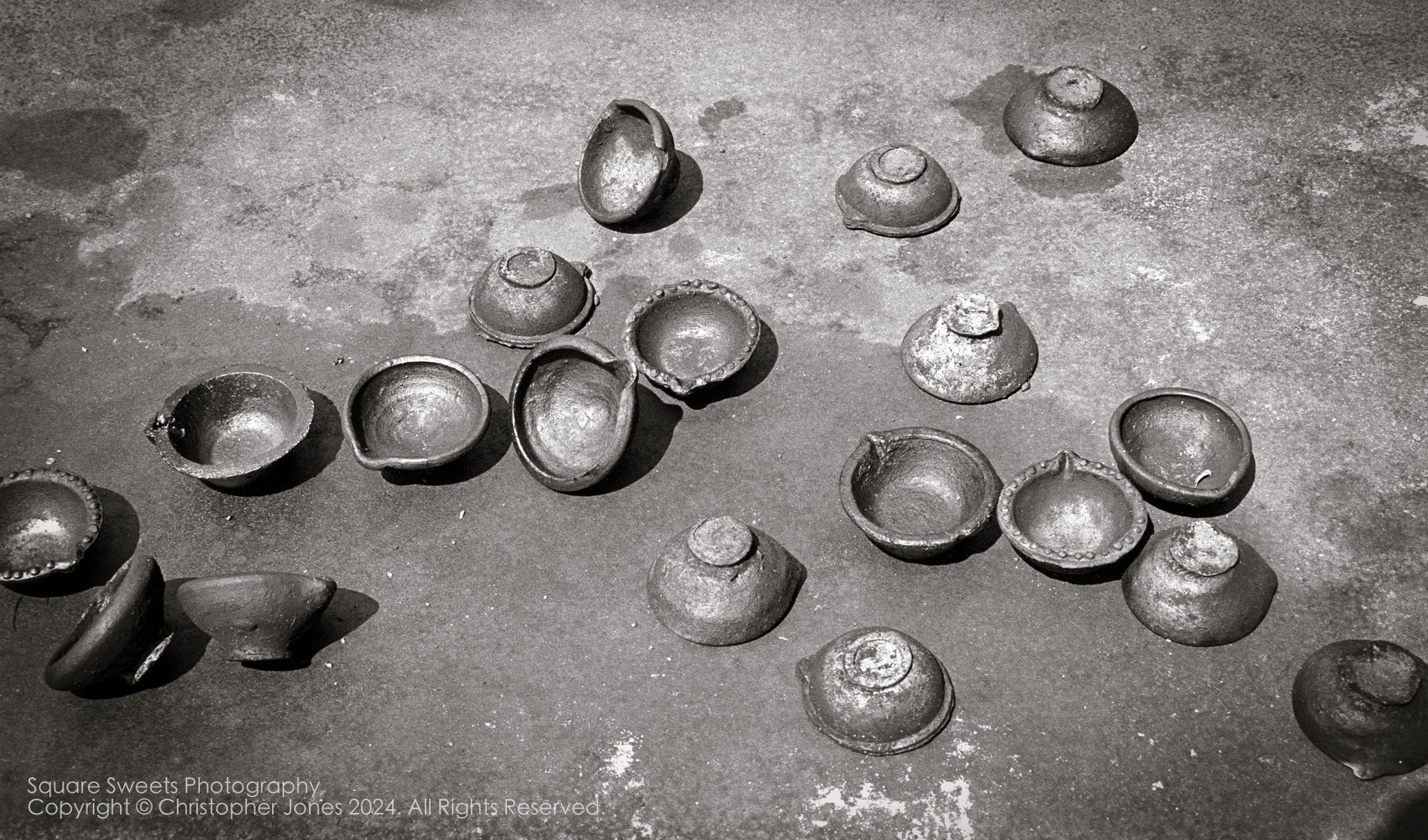 Offering oil lamps at Medirigiriya Vatadage, Sri Lanka